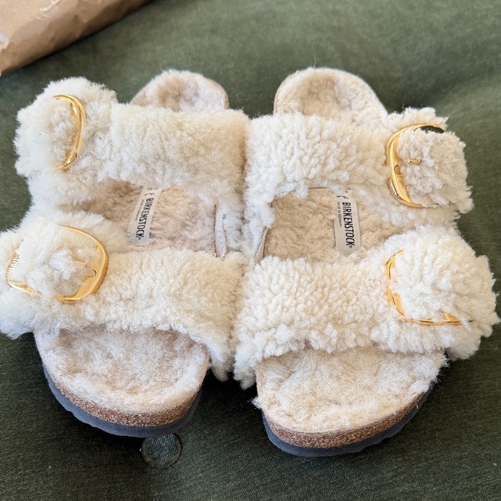 Birkenstock’s Women’s Sherpa in Cream with Gold Buckles